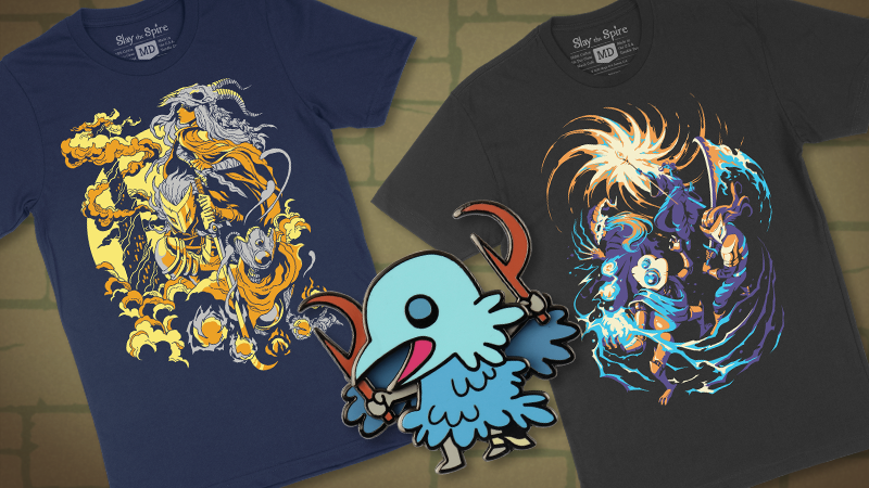 Two t-shirts featuring characters from Slay the Spire and an enamel pin of a Cultist with moving arms